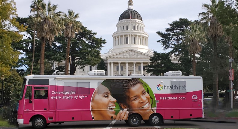 Health Net Mobile Vaccination Clinic RV in front of California State Capitol building
